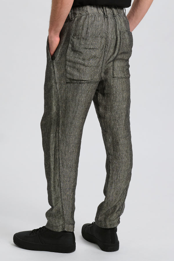 Loose fit trousers with front pleats in two-tone fil a fil linen. Elastic waistband and back patch po | 1017.CFUTRCK200.U302